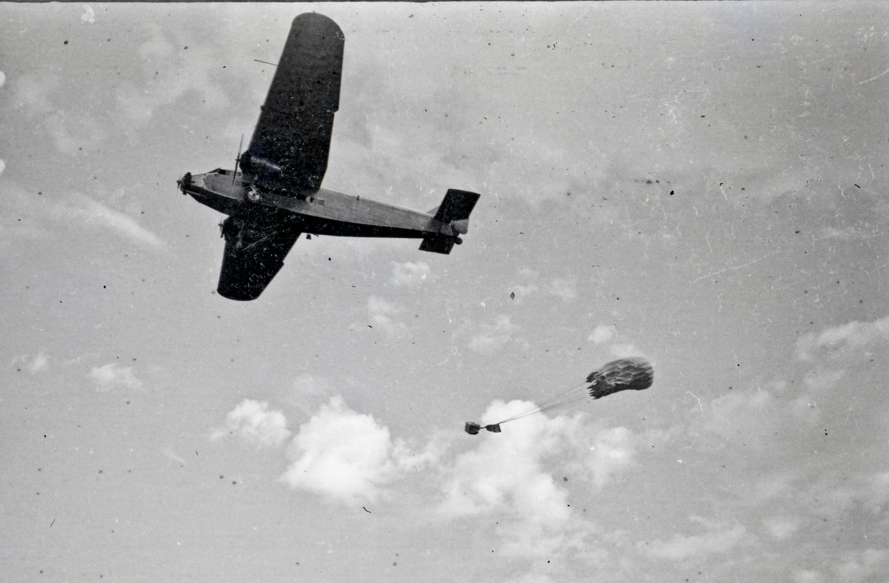 A Forest Service planes drop food and water to the recovery crew